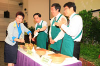 Dr. Poon Kit gives a hand to prepare the green salad